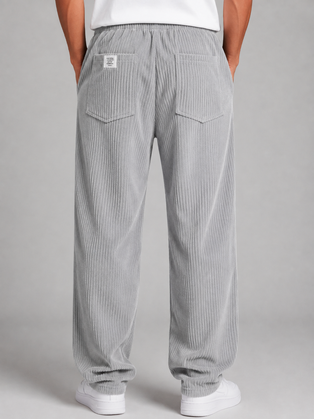 Men's relaxed corduroy drawstring trousers, close up of drawstring waist