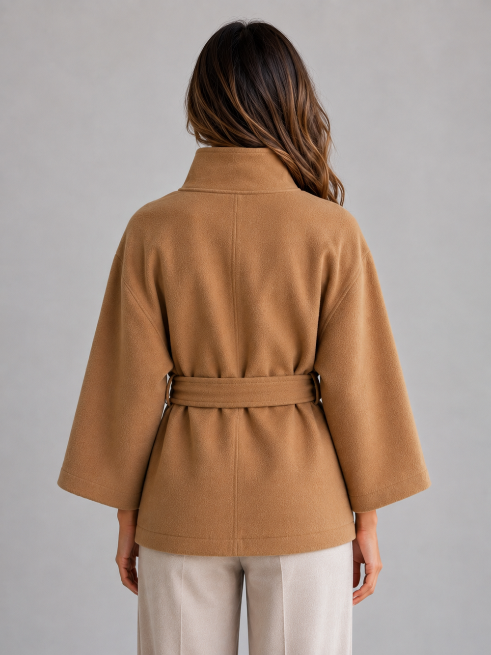 Women's belted cape jacket with stand collar, close up of stand collar